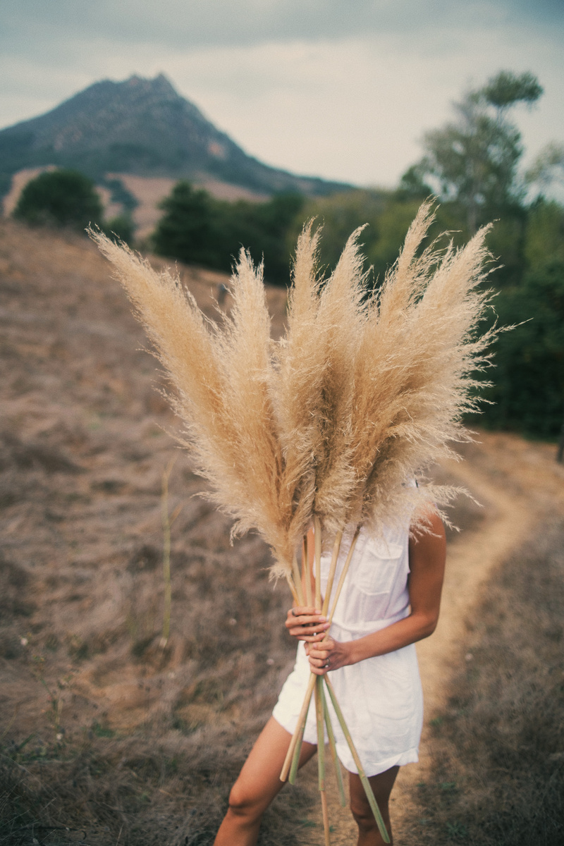 Woman Covered by Hay